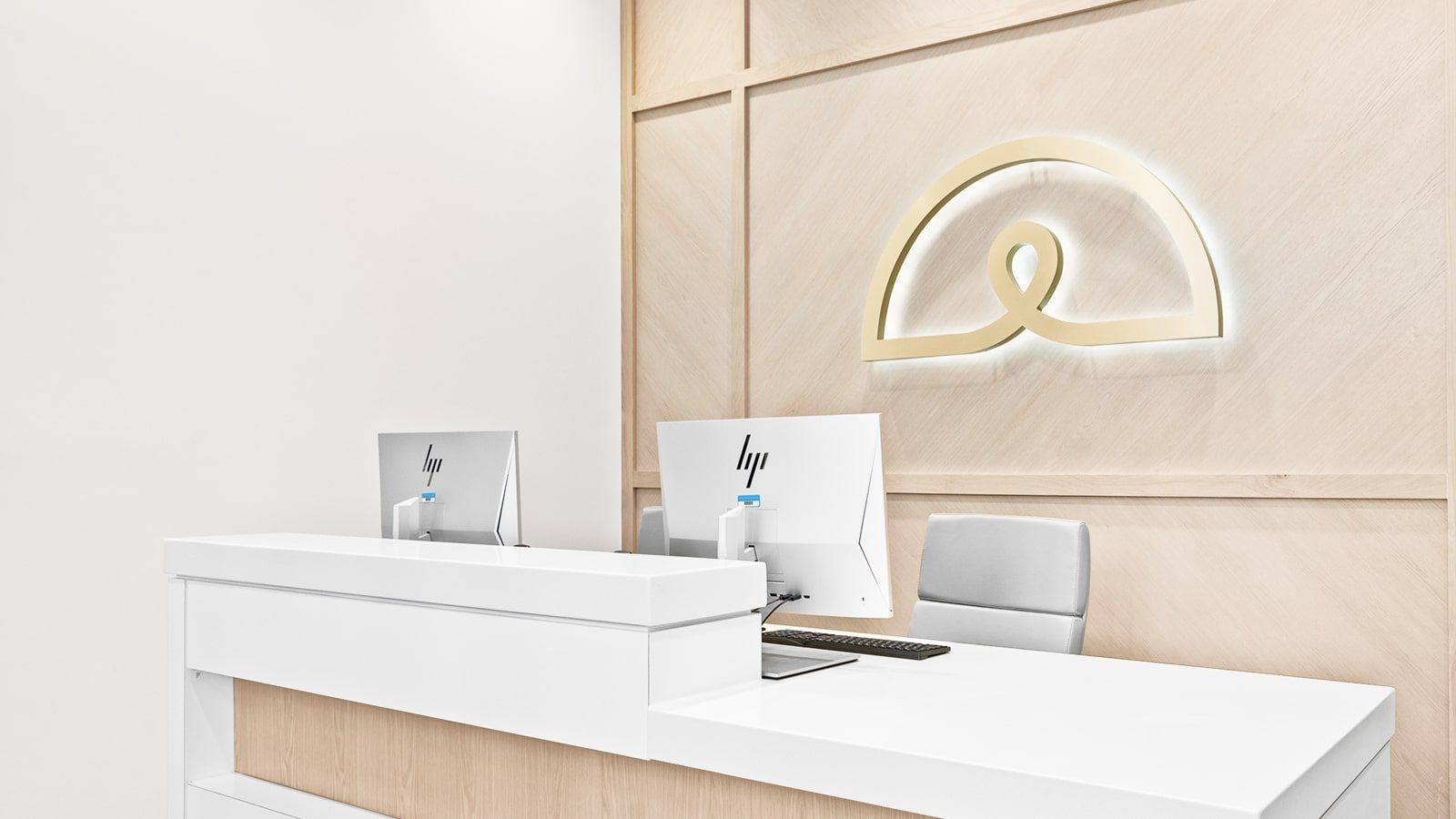 Ideal Image reception area with two computer monitors.