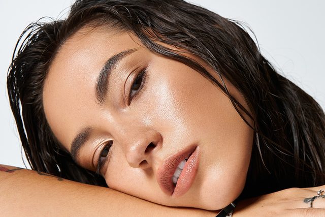 Closeup of woman's face with dark eyes and dark hair.